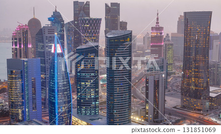 The skyline of the West Bay area from top in Doha day to night timelapse, Qatar. The skyline of the West Bay area from top in Doha day to night timelapse, Qatar. 131851069