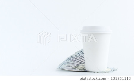 Coffee Cup and Money, Concept of Business Investment and Financial Success. Isolated on White Coffee Cup and Money, Concept of Business Investment and Financial Success. Isolated on White 131851113
