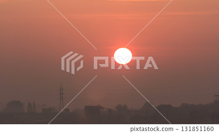 Sunrise at city with high-voltage power transmission line timelapse 131851160