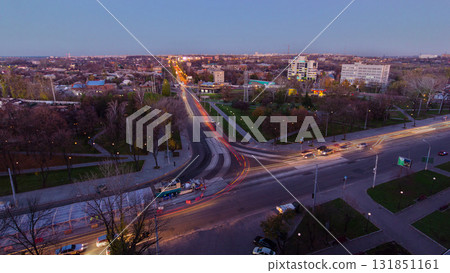 Road intersection with reconstructed tram tracks aerial panoramic day to night timelapse. 131851161
