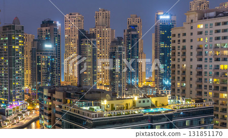 Aerial view of Dubai Marina after sunset from a vantage point day to night timelapse. Aerial view of Dubai Marina after sunset from a vantage point day to night timelapse. 131851170