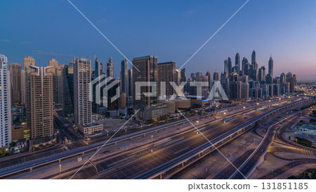 Dubai Marina skyscrapers aerial top view before sunrise from JLT in Dubai night to day timelapse, UAE. 131851185