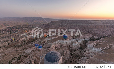 Aerial view from hot air balloon during Sunrise over the fairytale landscape hills of Kapadokya timelapse hyperlapse with morning light. 131851263
