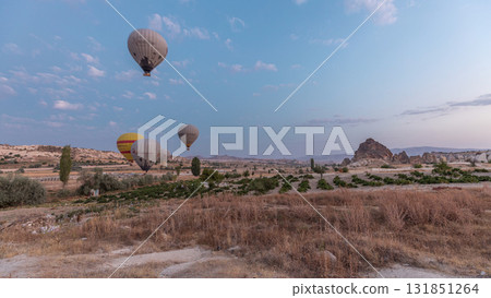 Beautiful colorful hot air balloons take off and flying in clear morning sky timelapse in Cappadocia, Turkey Beautiful colorful hot air balloons take off and flying in clear morning sky timelapse in Cappadocia, Turkey 131851264