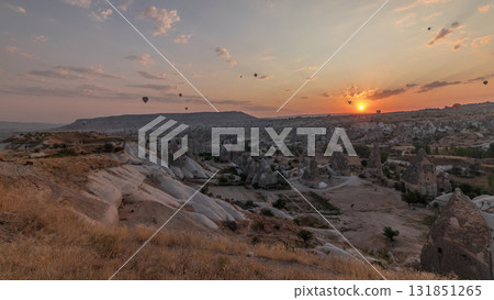 Beautiful sunrise with colorful hot air balloons take off and flying in clear morning sky aerial timelapse in Cappadocia, Turkey 131851265