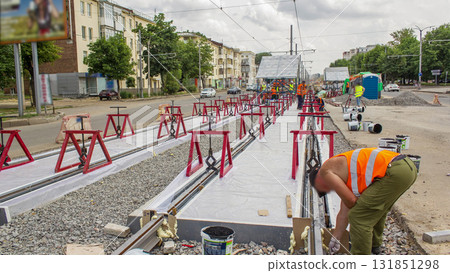 Tram rails at the stage of their installation and integration into concrete plates on the road timelapse. Tram rails at the stage of their installation and integration into concrete plates on the road timelapse. 131851298