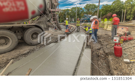 Concrete works for road construction with many workers and mixer timelapse hyperlapse Concrete works for road construction with many workers and mixer timelapse hyperlapse 131851304