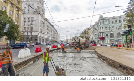 Concrete works for road maintenance construction with many workers and mixer machine timelapse 131851315