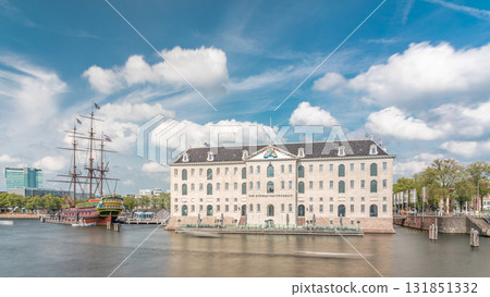 Hyperlapse of the National Maritime Museum with the sailboat replica Amsterdam docked nearby. Amsterdam, Netherlands Hyperlapse of the National Maritime Museum with the sailboat replica Amsterdam docked nearby. Amsterdam, Netherlands 131851332