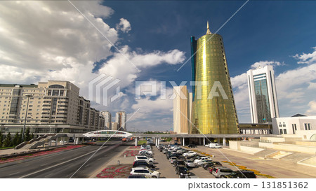 Traffic on the road and car parking timelapse hyperlapse near Altyn Orda business center in downtown of Nur-Sultan city, Kazakhstan 131851362