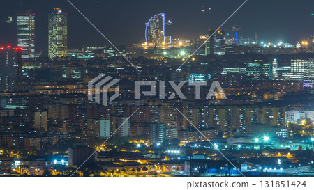 Barcelona and Badalona skyline with roofs of houses and sea on the horizon day to night timelapse 131851424