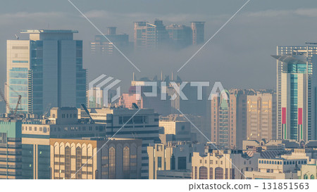 Skylines under the thick fog at the street timelapse of Abu Dhabi at morning 131851563