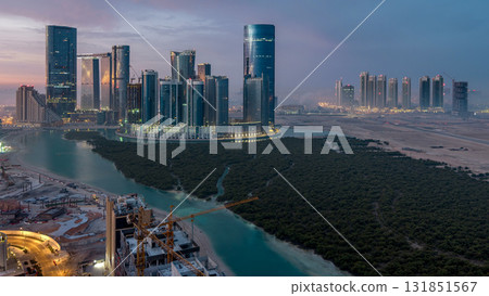 Buildings on Al Reem island in Abu Dhabi timelapse from above. Buildings on Al Reem island in Abu Dhabi timelapse from above. 131851567
