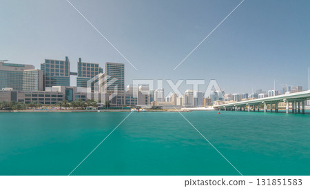 Modern buildings in Abu Dhabi skyline timelapse hyperlapse with mall and beach. Modern buildings in Abu Dhabi skyline timelapse hyperlapse with mall and beach. 131851583