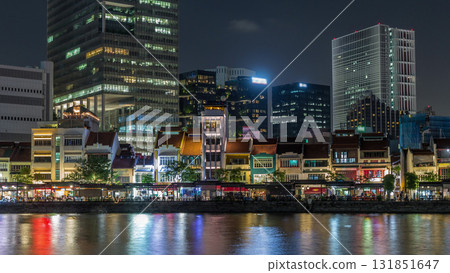Singapore quay with tall skyscrapers in the central business district on Boat Quay night timelapse hyperlapse Singapore quay with tall skyscrapers in the central business district on Boat Quay night timelapse hyperlapse 131851647