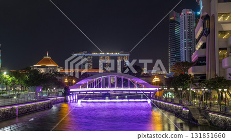 Skyline of Singapore financial district behind Elgin Bridge and the Singapore River night timelapse hyperlapse Skyline of Singapore financial district behind Elgin Bridge and the Singapore River night timelapse hyperlapse 131851660
