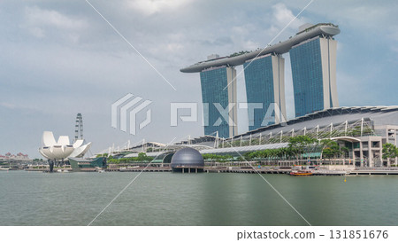 Fifty-five storeys high Marina Bay Sands Hotel dominates the skyline at Marina Bay in Singapore timelapse hyperlapse. 131851676