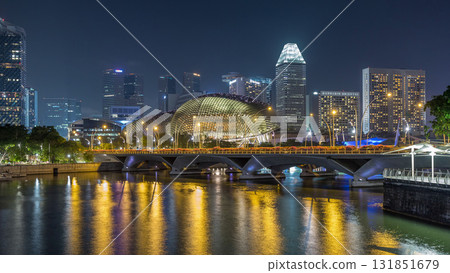 Illuminated Double Esplanade Theatres domes behind Esplanade Drive with traffic night timelapse hyperlapse 131851679