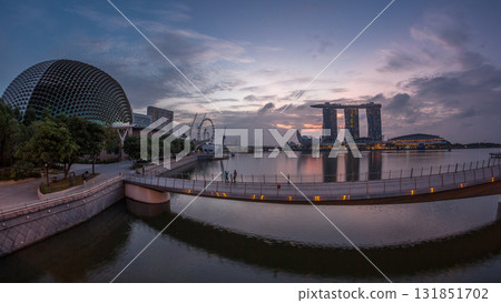 Skyline in Marina Bay with Esplanade Theaters on the Bay and Esplanade footbridge night to day timelapse in Singapore. Skyline in Marina Bay with Esplanade Theaters on the Bay and Esplanade footbridge night to day timelapse in Singapore. 131851702