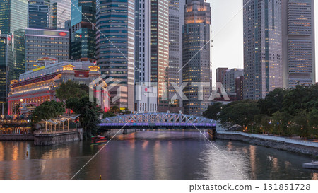 Singapore skyscrapers skyline with white Anderson Bridge near esplanade park day to night timelapse. 131851728