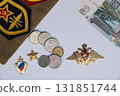 Russian Soviet military cap with service patches with ruby stars and hammer and sickle emblems. Medal with double headed eagle and red coat of arms. High quality photo 131851744