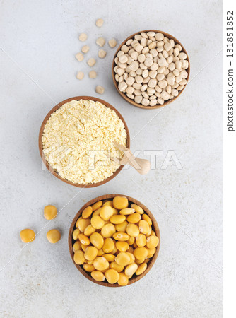 Gluten free lupine flour, dry lupine beans, protein rich snack of pickled lupine beans on gray background. Top view. Gluten free lupine flour, dry lupine beans, protein rich snack of pickled lupine beans on gray background. Top view. 131851852