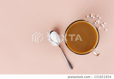 A cup of coffee with milk and a spoonful of natural stevia sweetener. Top view. Copy space. 131851854