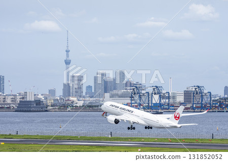 Scenery of Haneda Airport, plane taking off and Tokyo Skytree, Ota Ward, Tokyo 131852052