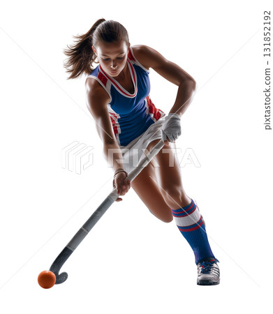 Female Field Hockey Player Striking Orange Ball 131852192
