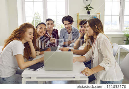 Group of college or university students working on digital presentation and using laptop 131852378
