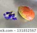 Ripe mango and butterfly pea flower 131852567