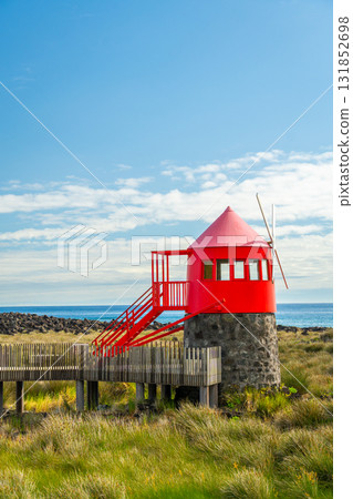 Moinho do Juncal Windmill and Atlantic Ocean. Azores, Pico Island. Portugal 131852698