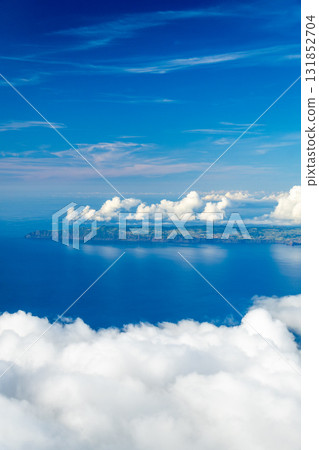 Sao Jorge Island and Clouds on Sunny Day. View from Mount Pico, Azores. Portugal Sao Jorge Island and Clouds on Sunny Day. View from Mount Pico, Azores. Portugal 131852704