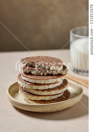 stack of rice cakes covered with milk chocolate 131852876
