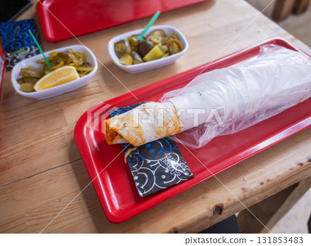 [Turkey] Chicken shwarma and pickles lined up on a restaurant table in the suburbs of Istanbul 131853483