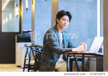 Man working on laptop in office 131853975