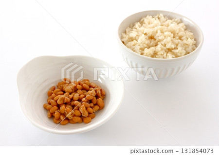 Brown rice and natto on white background Brown rice and natto on white background 131854073