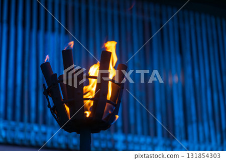 Burning torches in front of traditional buildings in Okinawa, Japan Burning torches in front of traditional buildings in Okinawa, Japan 131854303