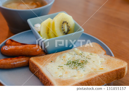Western-style breakfast of cheese toast, sausage, soup and fruit Western-style breakfast of cheese toast, sausage, soup and fruit 131855157