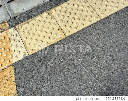 Braille blocks on the sidewalk Braille blocks on the sidewalk 131855284