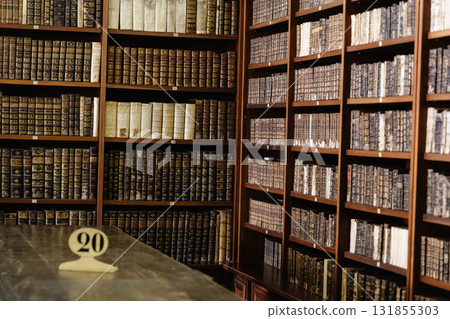 Grand Ancient Library Shelves Filled With Vintage Leather Bound Books 131855303