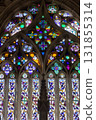 Vibrant Gothic Stained Glass Window with Intricate Floral Patterns 131855314