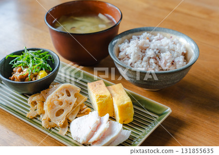 Japanese-style breakfast of tamagoyaki (rolled omelet), chicken breast, lotus root stir-fry, and miso soup Japanese-style breakfast of tamagoyaki (rolled omelet), chicken breast, lotus root stir-fry, and miso soup 131855635