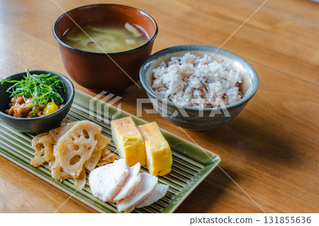 Japanese-style breakfast of tamagoyaki (rolled omelet), chicken breast, lotus root stir-fry, and miso soup Japanese-style breakfast of tamagoyaki (rolled omelet), chicken breast, lotus root stir-fry, and miso soup 131855636