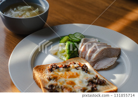 A healthy breakfast of cheese toast, chicken breast, vegetables and soup A healthy breakfast of cheese toast, chicken breast, vegetables and soup 131855714