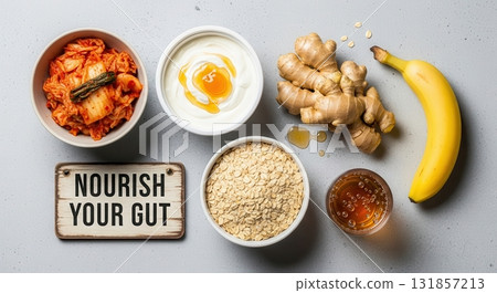 Nourish your gut sign surrounded by probiotic and prebiotic foods, healthy eating flat lay Nourish your gut sign surrounded by probiotic and prebiotic foods, healthy eating flat lay 131857213