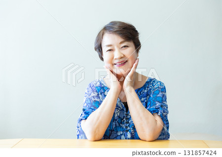 Senior woman smiling with a relaxed expression, upper body Senior woman smiling with a relaxed expression, upper body 131857424