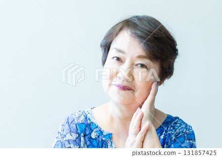 Senior woman smiling with a relaxed expression, upper body 131857425