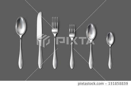 Set of Metallic Flatware on Dark Gray Background 131858839