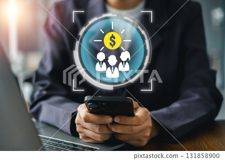 Business professional using smartphone with digital crowd funding icon, symbolizing financial growth and innovation. Business professional using smartphone with digital crowd funding icon, symbolizing financial growth and innovation. 131858900